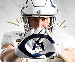 Photo: Aggie football player holds CA logo in hands (graphic)