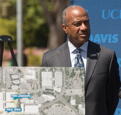 Photo: Chancellor Gary S. May at April 12 news conference, with map of Aggie Square.