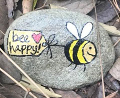 Photo: Rock painted with bee and phrase bee happy