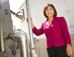 Photo: Ruihong Zhang next to biodigester