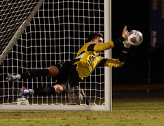 Photo: Aggie goalkeeper Jon Laughlin (almost horizontal) makes a save