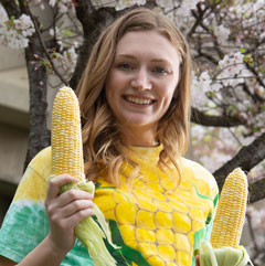 Katherine “Katie” Murphy holds two ears of corn.