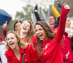 Exuberant participants in red heart T-shirts at the 2014 UC Davis Wears Red Day heart formation.