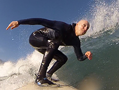 Photo: UC Davis veterinary surgeon Boaz Arzi, surfing off Pacifica.