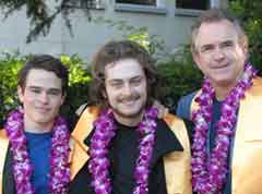 Photo: Julian Fletcher-Taylor, Sebastian Fletcher-Taylor and Prof. J. Edward Taylor, each wearing a lei on graduation day